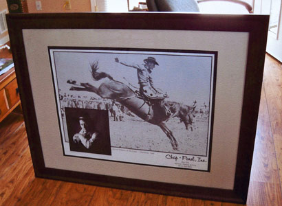 Framed Rodeo poster featuring Abilene's own Two Time All Around World Champion Cowboy, Gerald Roberts; donated by Beverly Willcoxon of Abilene, Kansas.